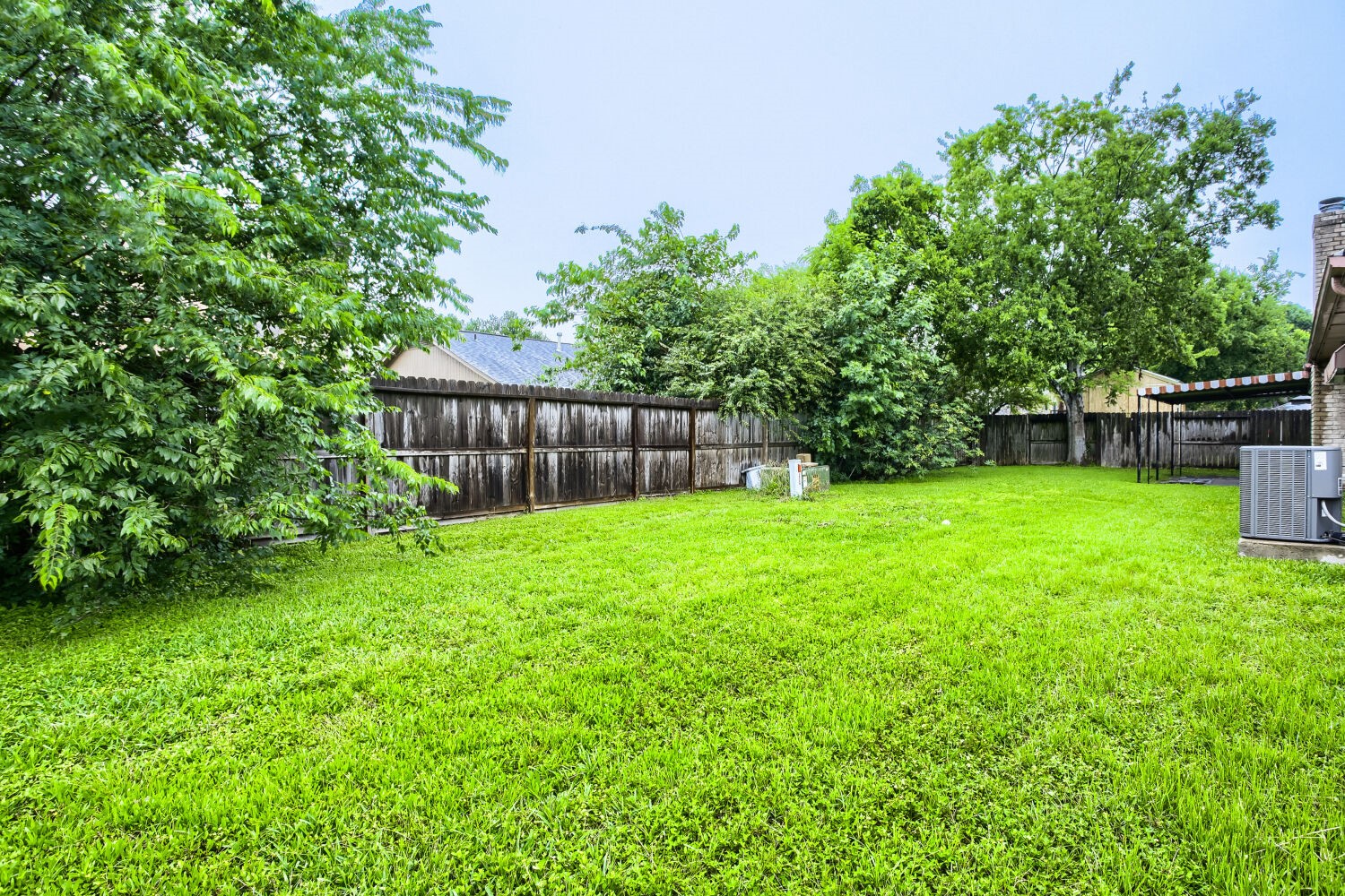 10103 Inwood Shadows Street Houston, TX 77088 - Photo 31 of 32 a view of a backyard with a garden