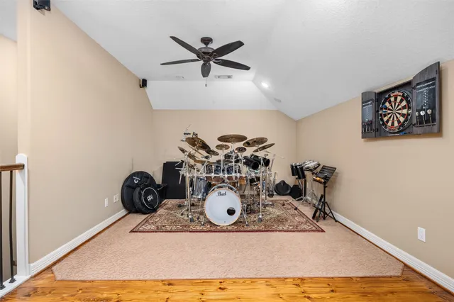 a room with gym equipment and a large window