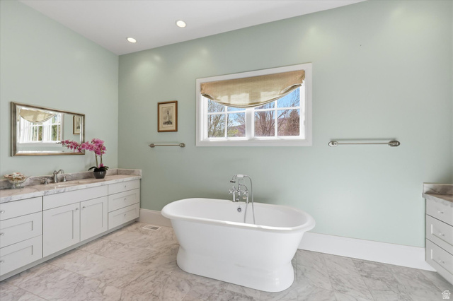 930 Price Farm Court Midway, UT 84049 - Photo 5 of 42 Master bath featuring twin vanities, a soaking tub, and walk-in shower