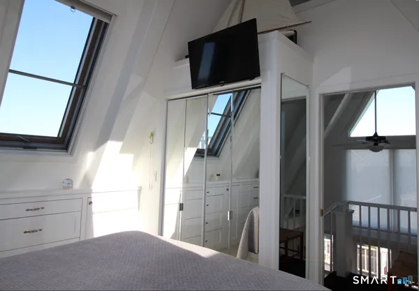 a view of hallway with stairs and furniture
