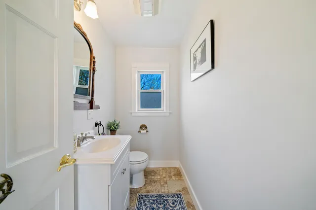 a view of a bedroom with furniture and chandelier