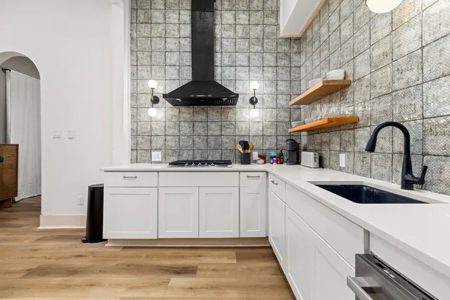 a kitchen with a sink and cabinets