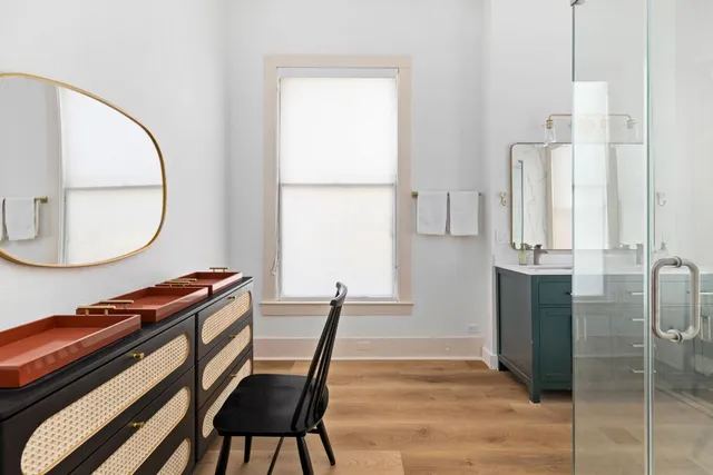 a view of a workspace room with furniture and wooden floor