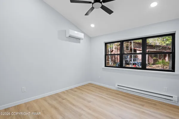 a view of an empty room with a window
