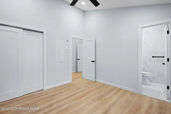 a view of empty room with a bathroom