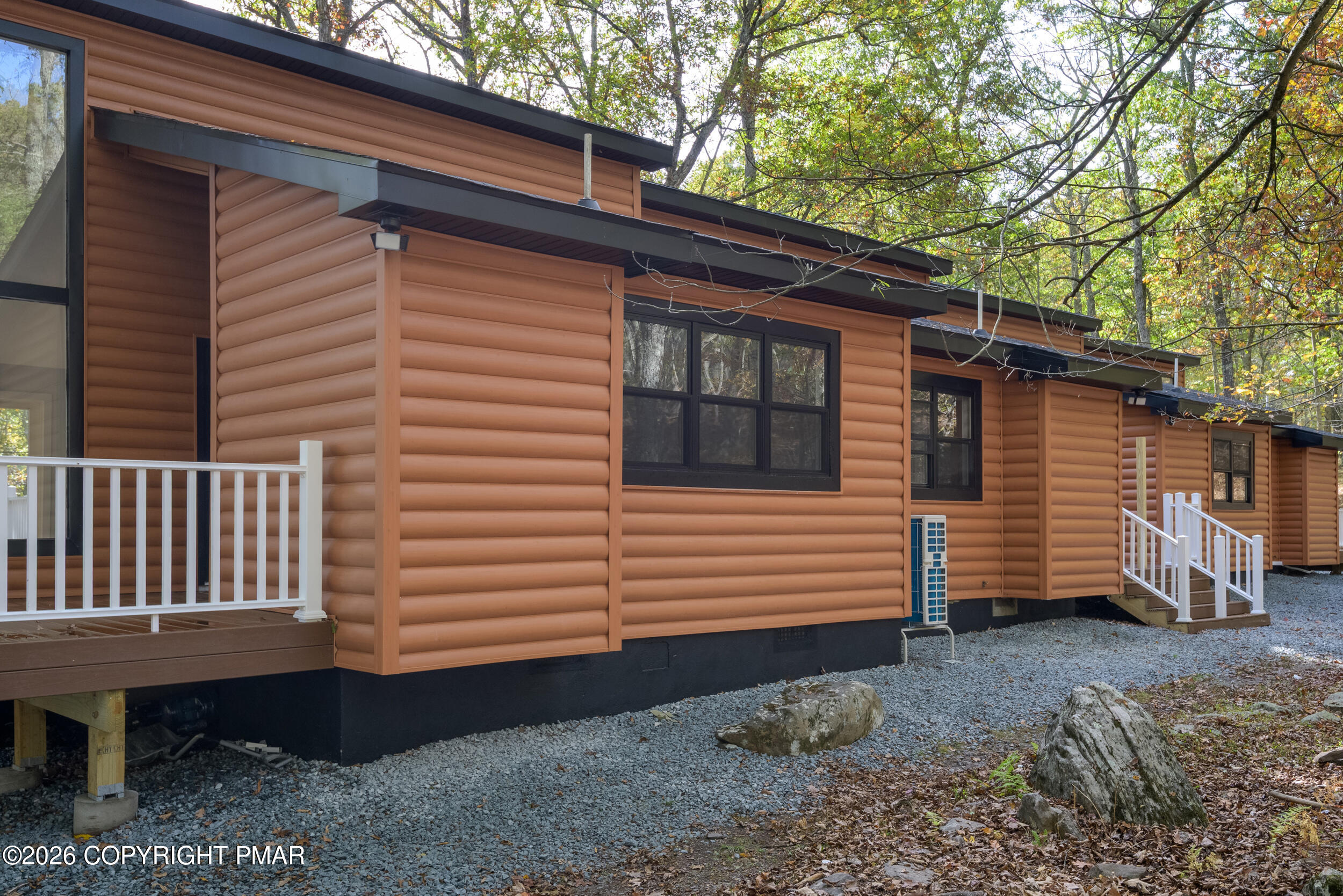 120 Twin Rivers Road, Unit B Lackawaxen, PA 18435 - Photo 2 of 29 a view of a back yard of the house