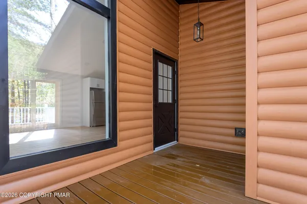 a view of entryway with a wooden door