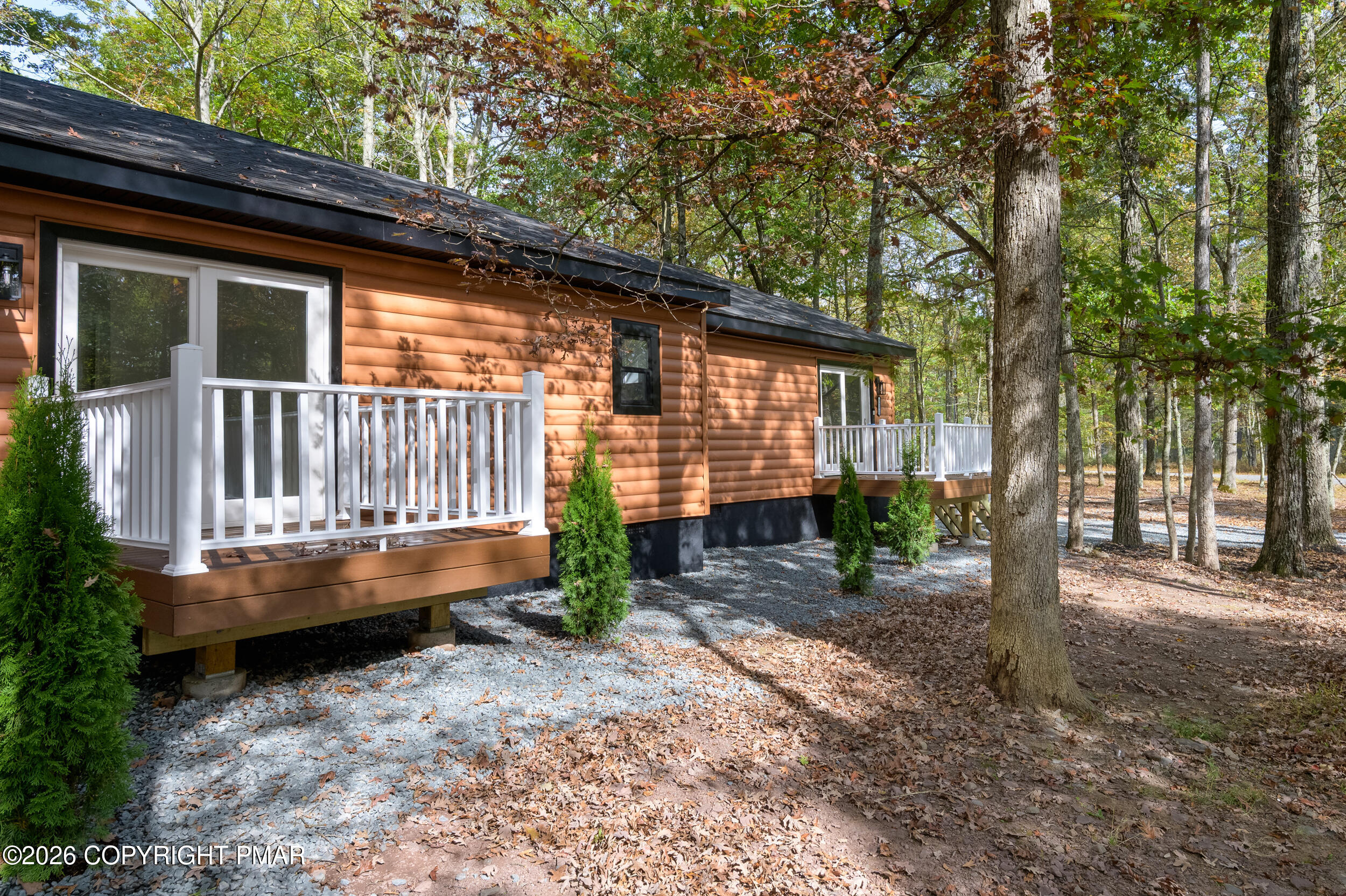 120 Twin Rivers Road, Unit B Lackawaxen, PA 18435 - Photo 28 of 29 a backyard of a house with garden and outdoor seating