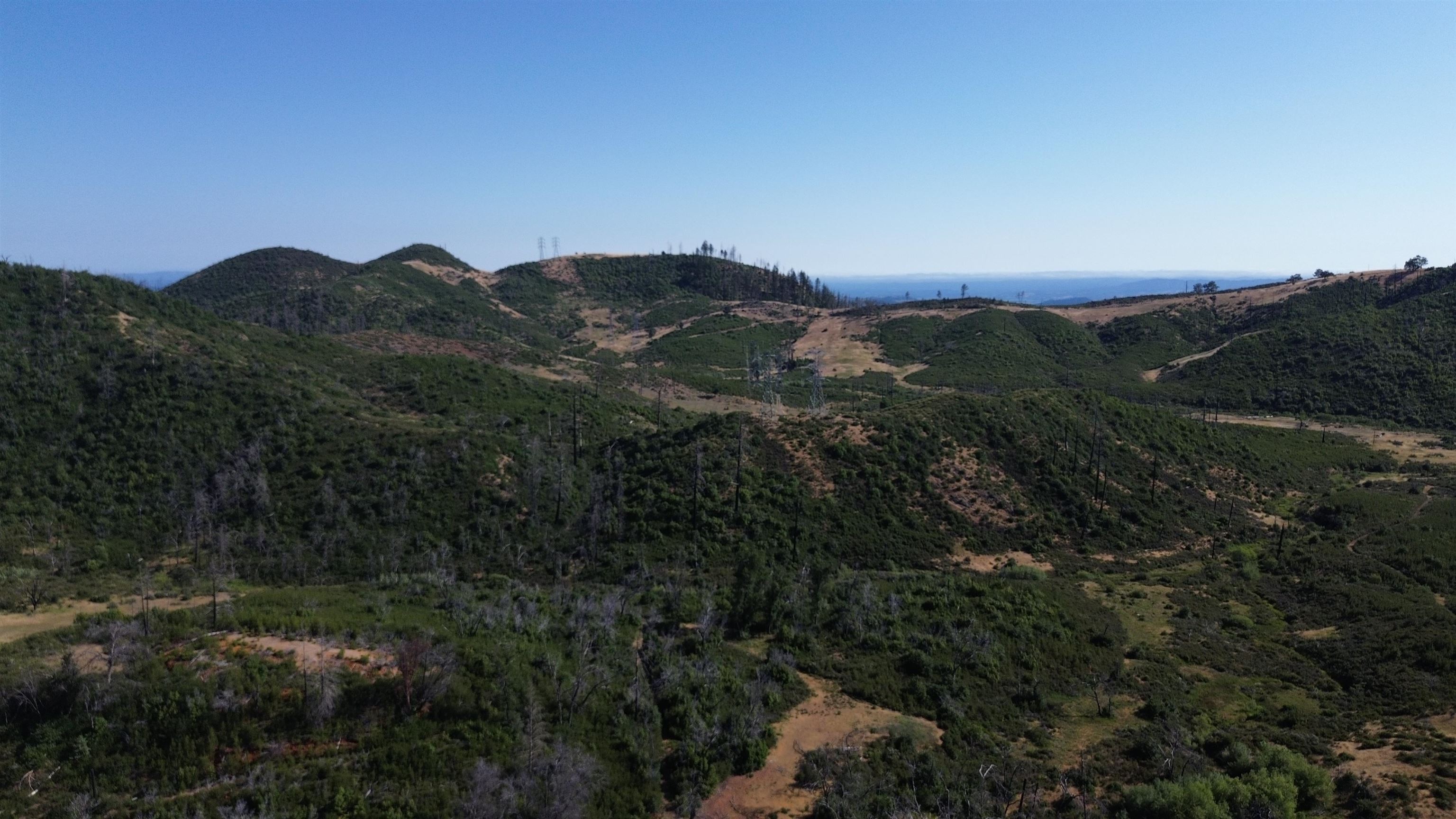 11311 Pine Flat Road Healdsburg, CA 95448 - Photo 11 of 45 a view of a mountain range with lush green forest