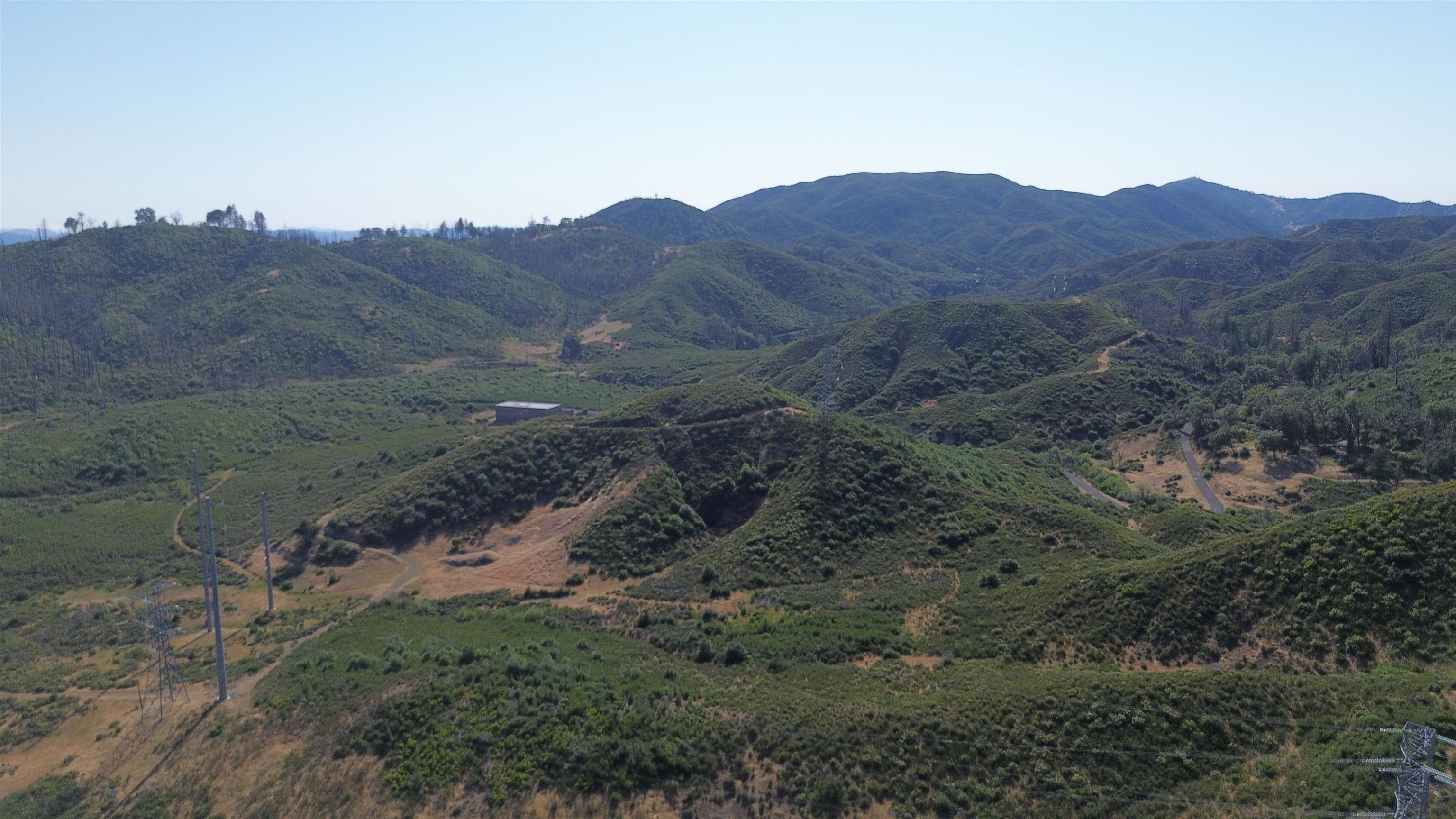 11311 Pine Flat Road Healdsburg, CA 95448 - Photo 15 of 45 a view of a house with a mountain and a forest
