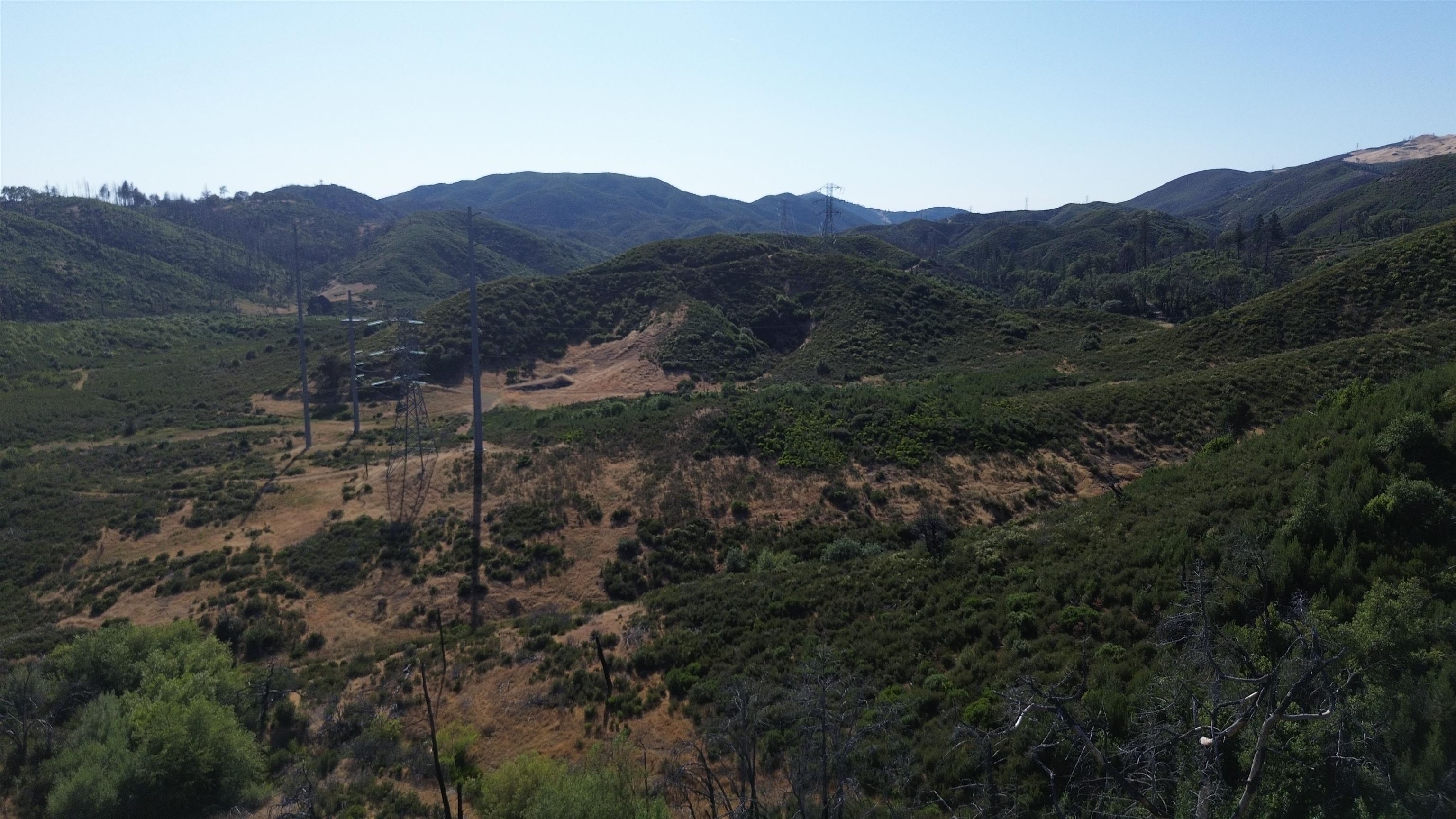 11311 Pine Flat Road Healdsburg, CA 95448 - Photo 28 of 45 a view of a house with a mountain and a forest