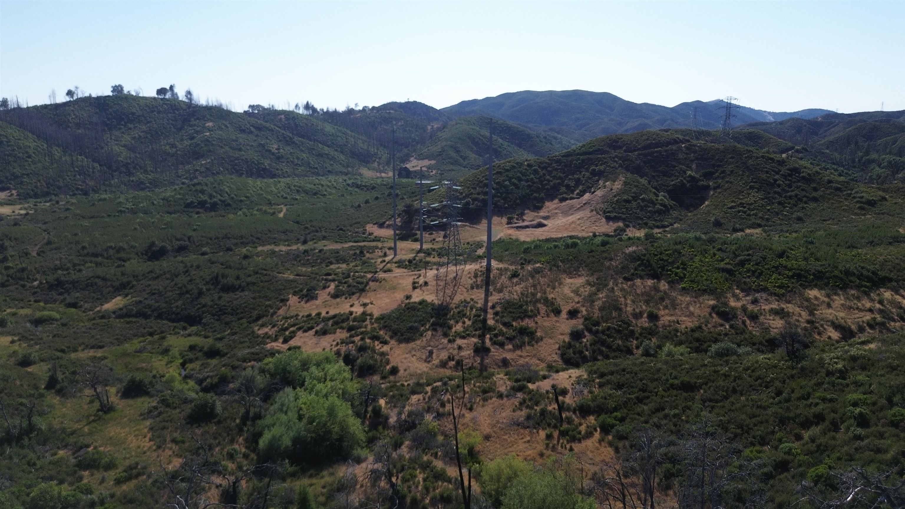 11311 Pine Flat Road Healdsburg, CA 95448 - Photo 30 of 45 a view of a lush green hillside and a mountain view