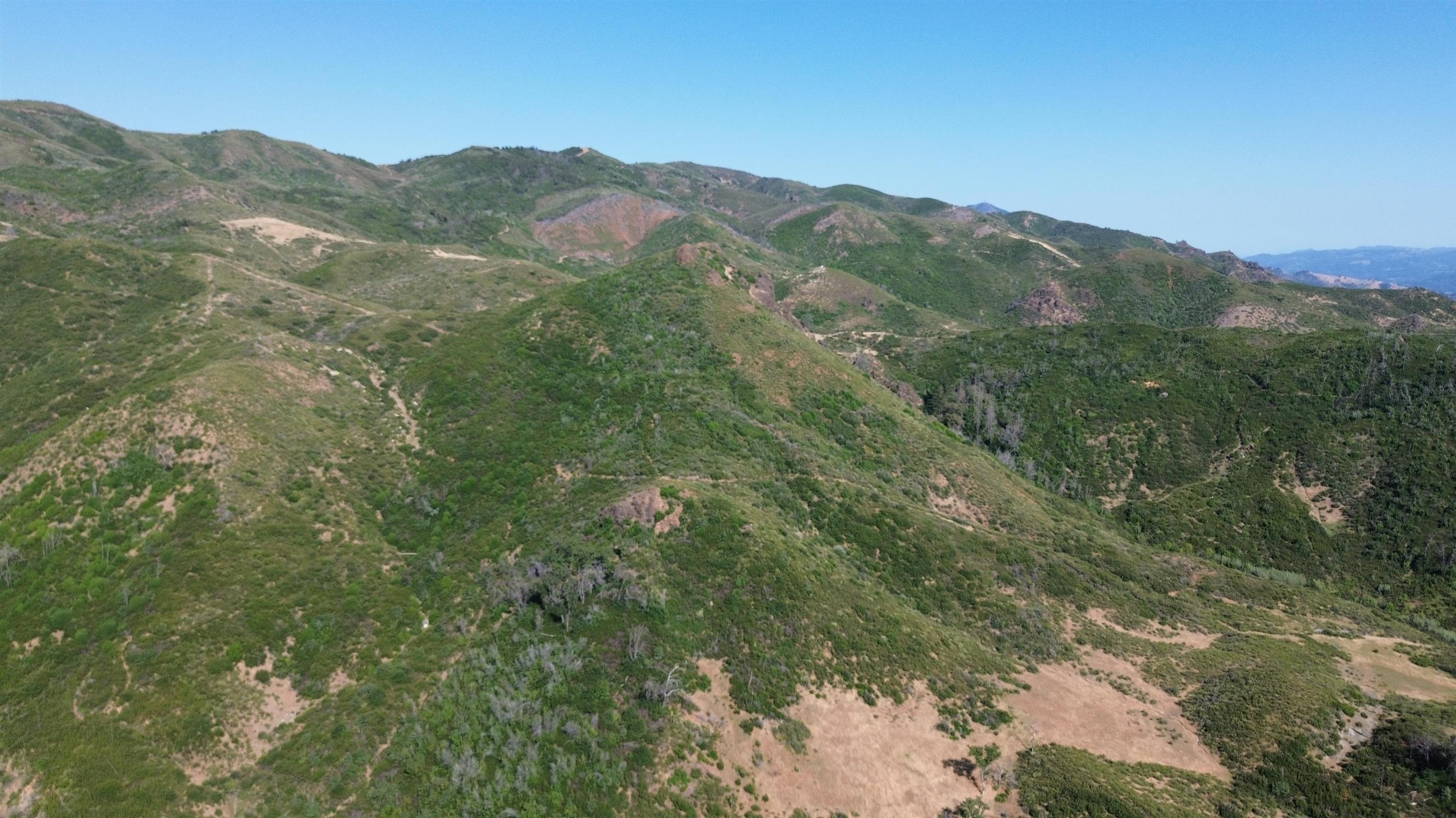 11311 Pine Flat Road Healdsburg, CA 95448 - Photo 4 of 45 a view of a mountain range with lush green forest