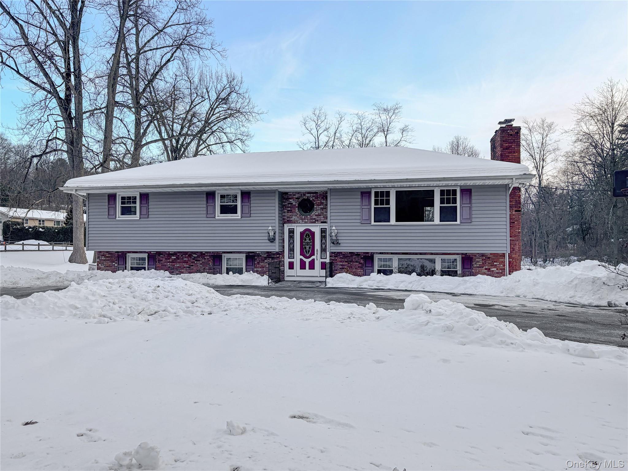25 East Mountain Road South Cold Spring, NY 10516 - Photo 1 of 48 a front view of a house with a yard