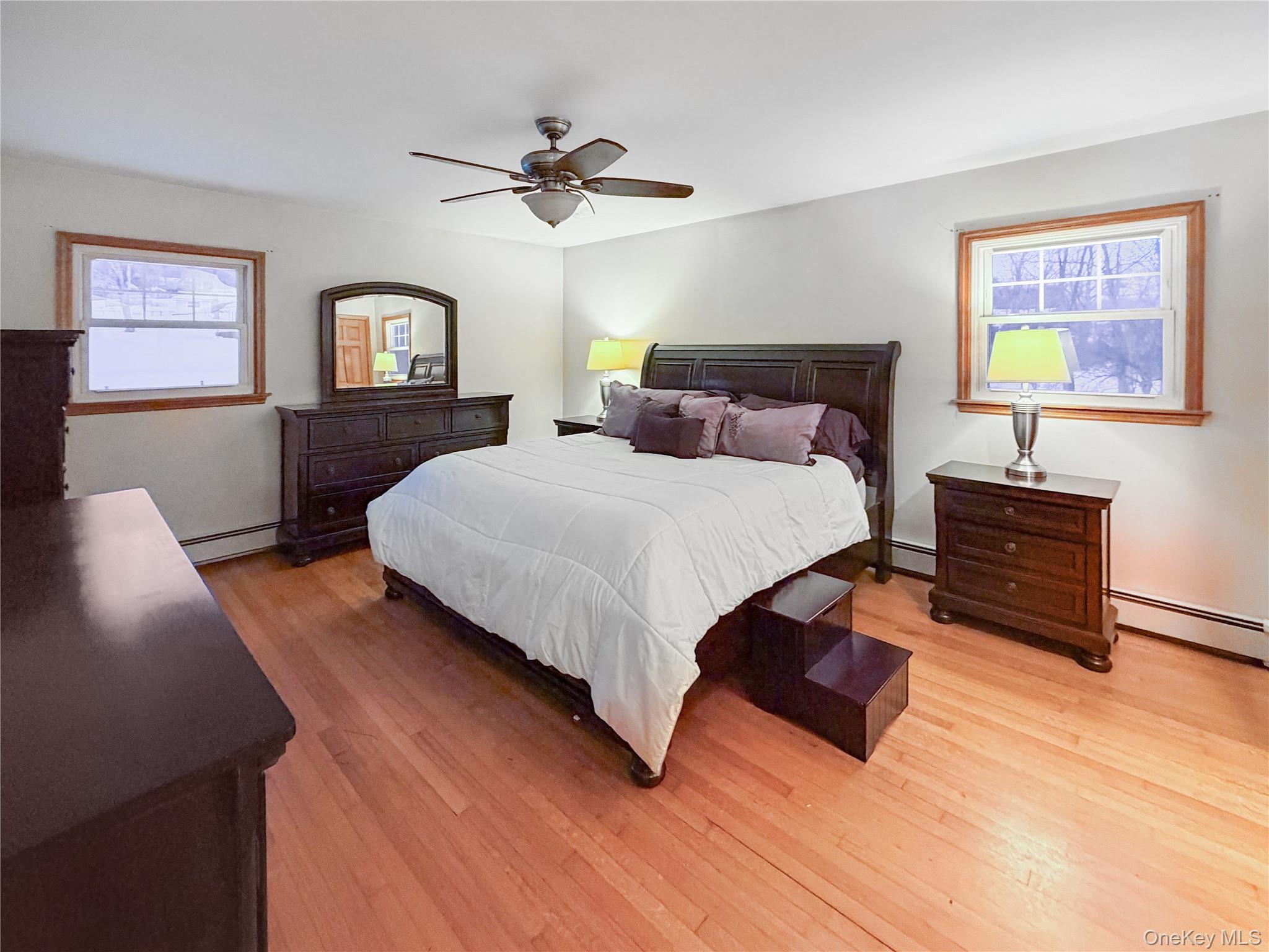 25 East Mountain Road South Cold Spring, NY 10516 - Photo 15 of 48 a bedroom with a bed lamps and window