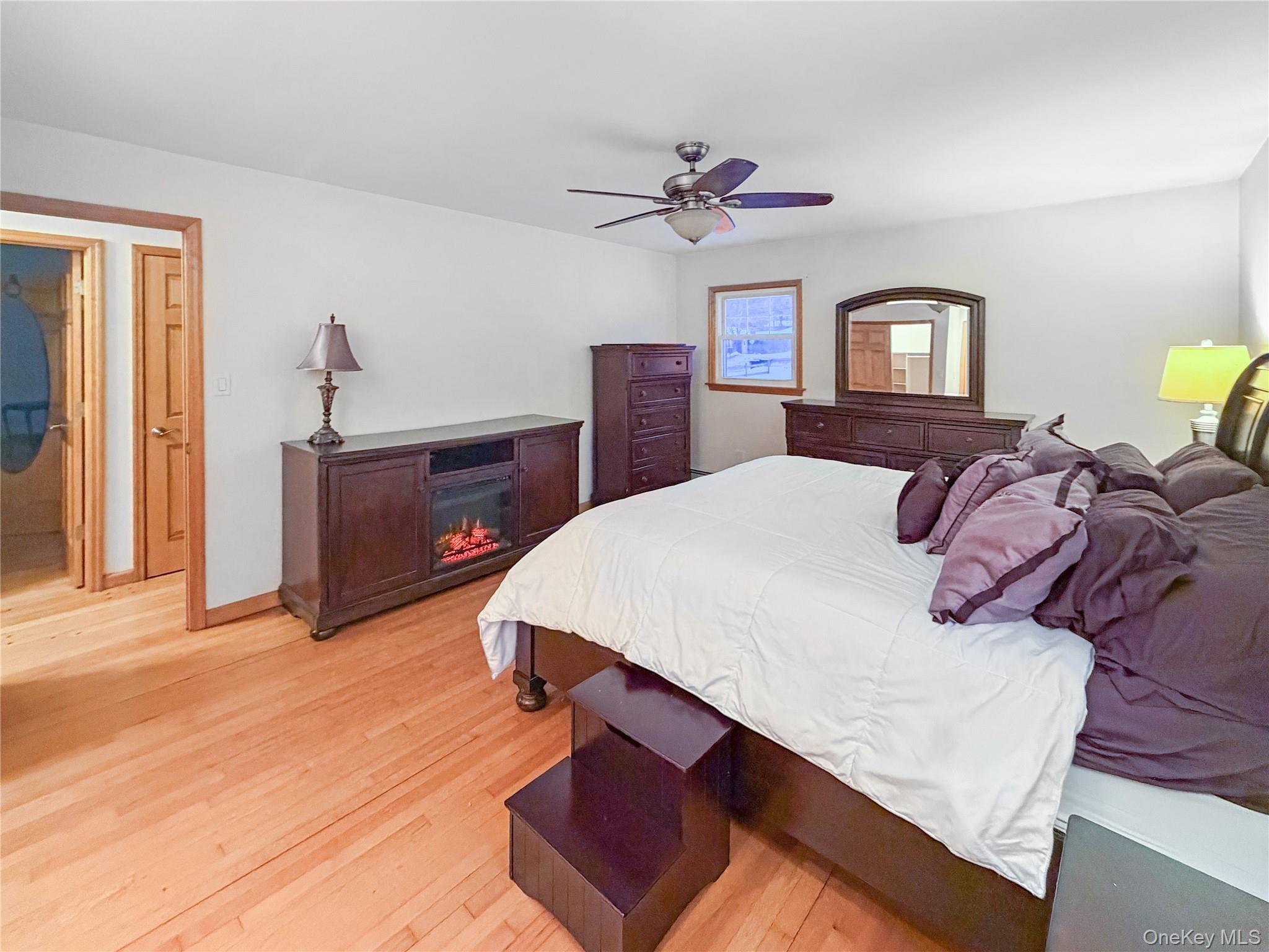 25 East Mountain Road South Cold Spring, NY 10516 - Photo 18 of 48 a bedroom with a bed and a dresser