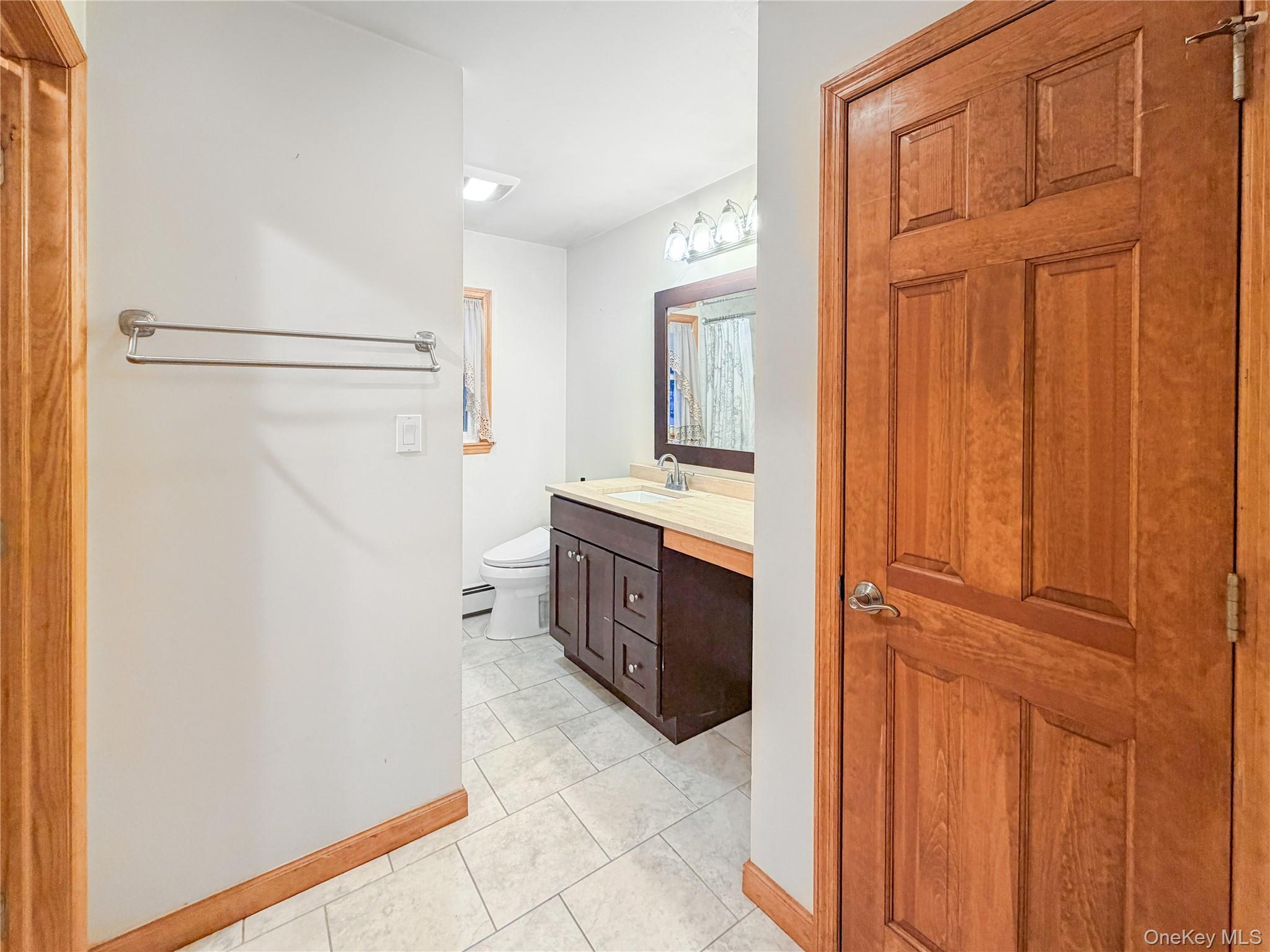 25 East Mountain Road South Cold Spring, NY 10516 - Photo 19 of 48 a bathroom with a double vanity sink and a mirror