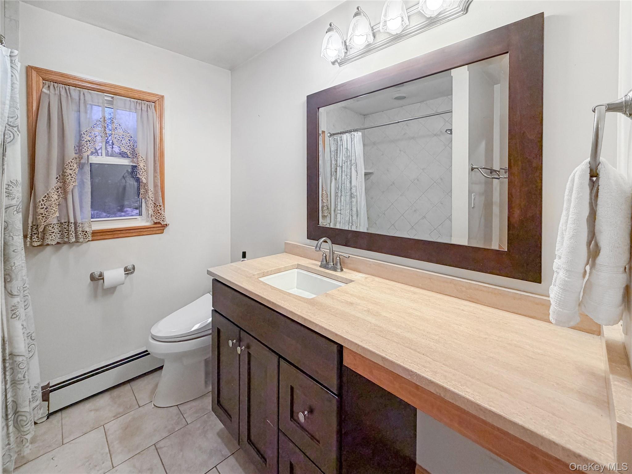 25 East Mountain Road South Cold Spring, NY 10516 - Photo 20 of 48 a bathroom with a granite countertop sink toilet and mirror