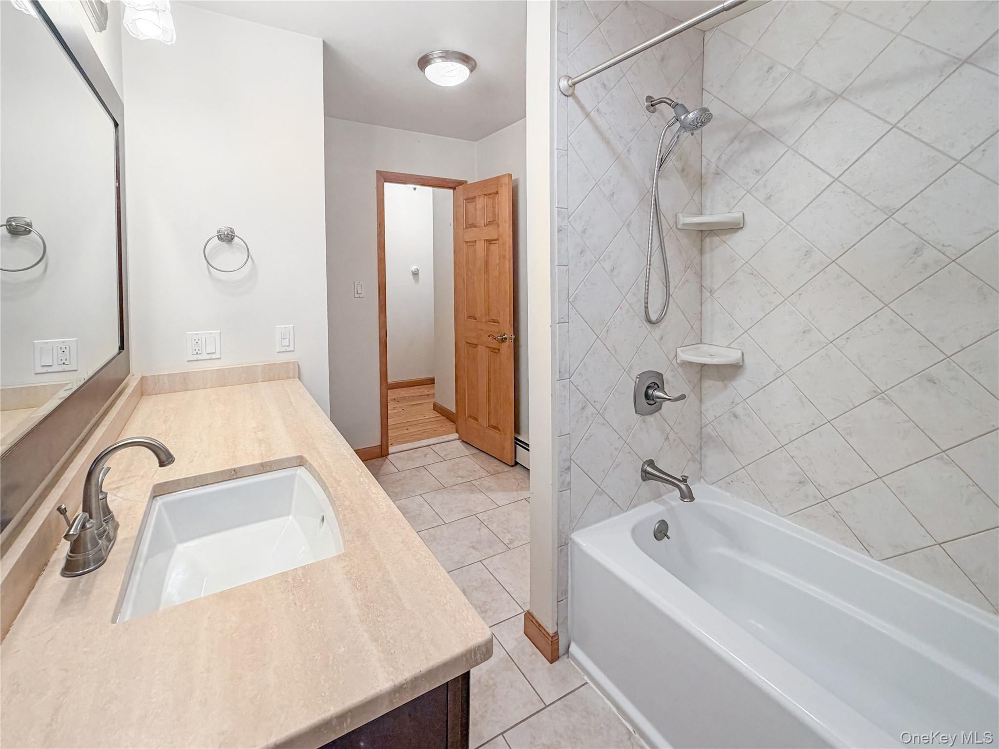 25 East Mountain Road South Cold Spring, NY 10516 - Photo 21 of 48 a bathroom with a sink a bathtub and shower