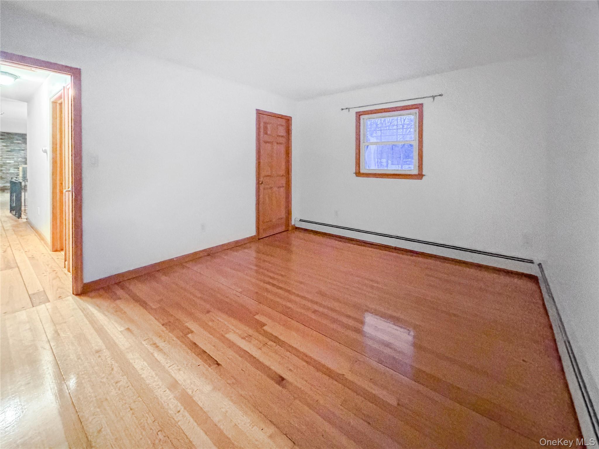 25 East Mountain Road South Cold Spring, NY 10516 - Photo 25 of 48 a view of an empty room with wooden floor