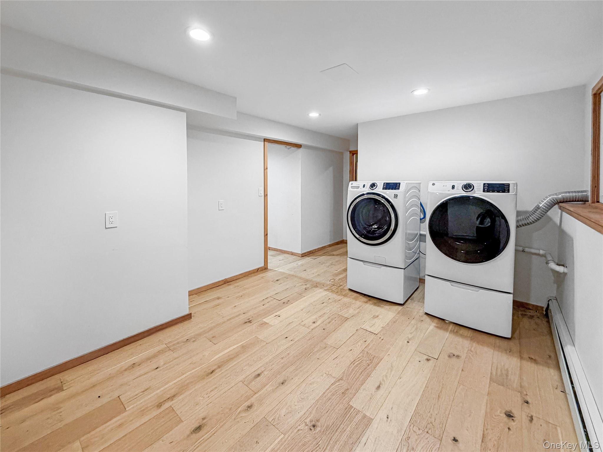 25 East Mountain Road South Cold Spring, NY 10516 - Photo 32 of 48 a view of washer and dryer with wooden floor