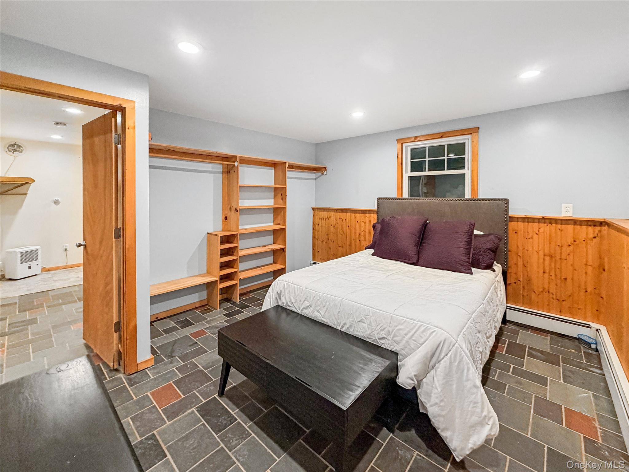 25 East Mountain Road South Cold Spring, NY 10516 - Photo 37 of 48 a bedroom with a bed and wooden floor