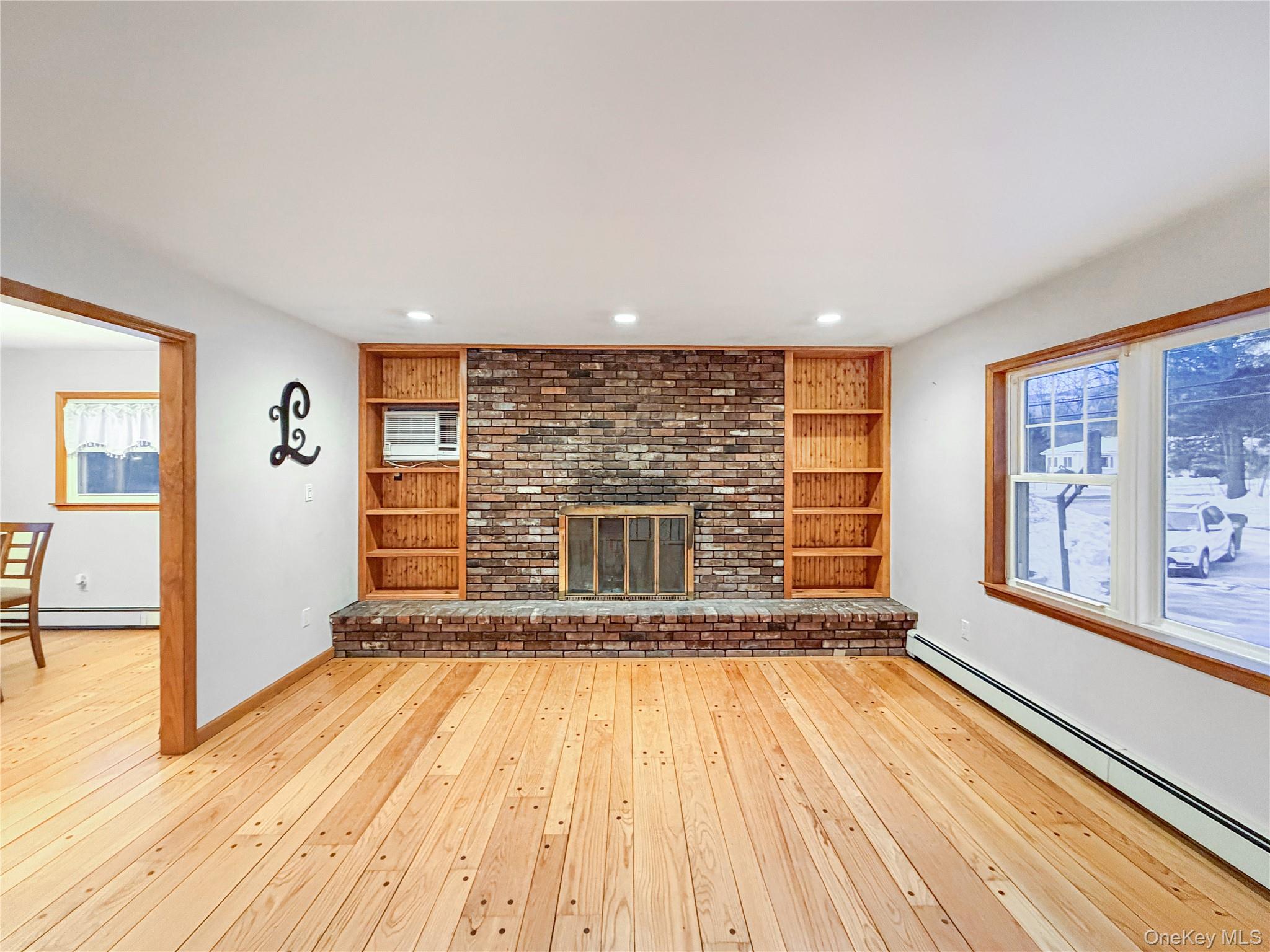25 East Mountain Road South Cold Spring, NY 10516 - Photo 5 of 48 a view of empty room with wooden floor and floor to ceiling window