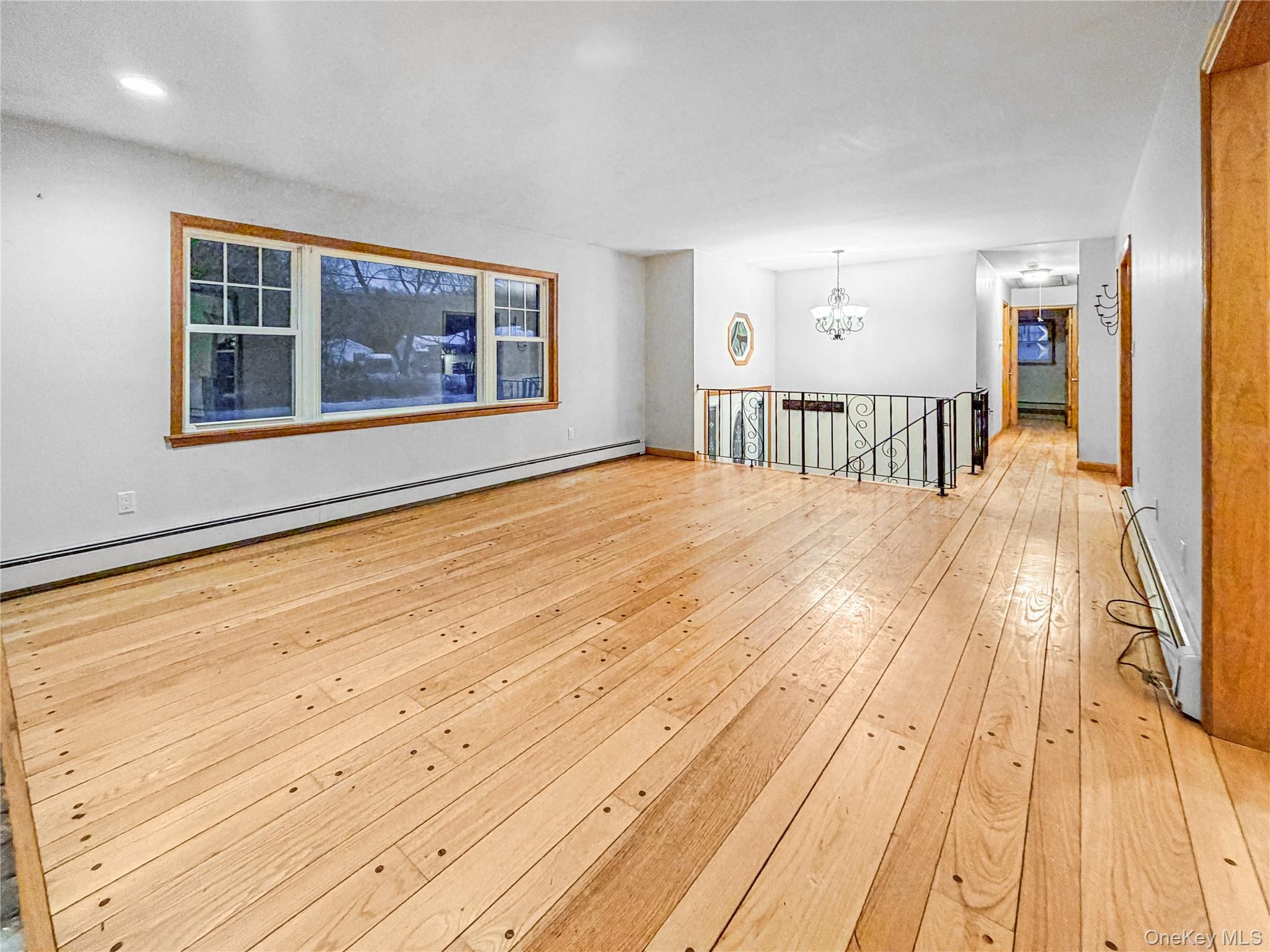 25 East Mountain Road South Cold Spring, NY 10516 - Photo 6 of 48 a view of empty room with wooden floor and windows