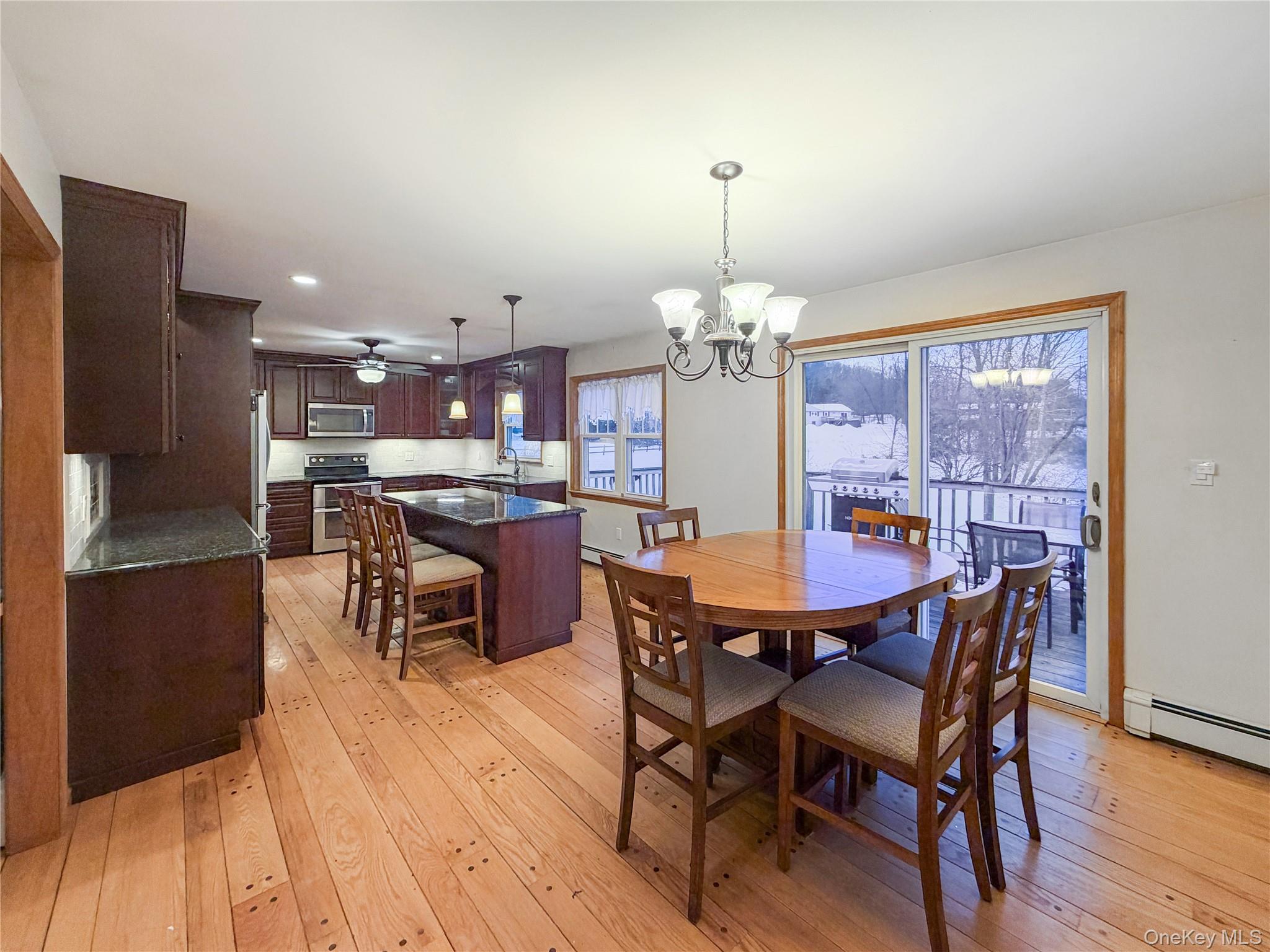 25 East Mountain Road South Cold Spring, NY 10516 - Photo 8 of 48 a view of a dining room with furniture window and wooden floor