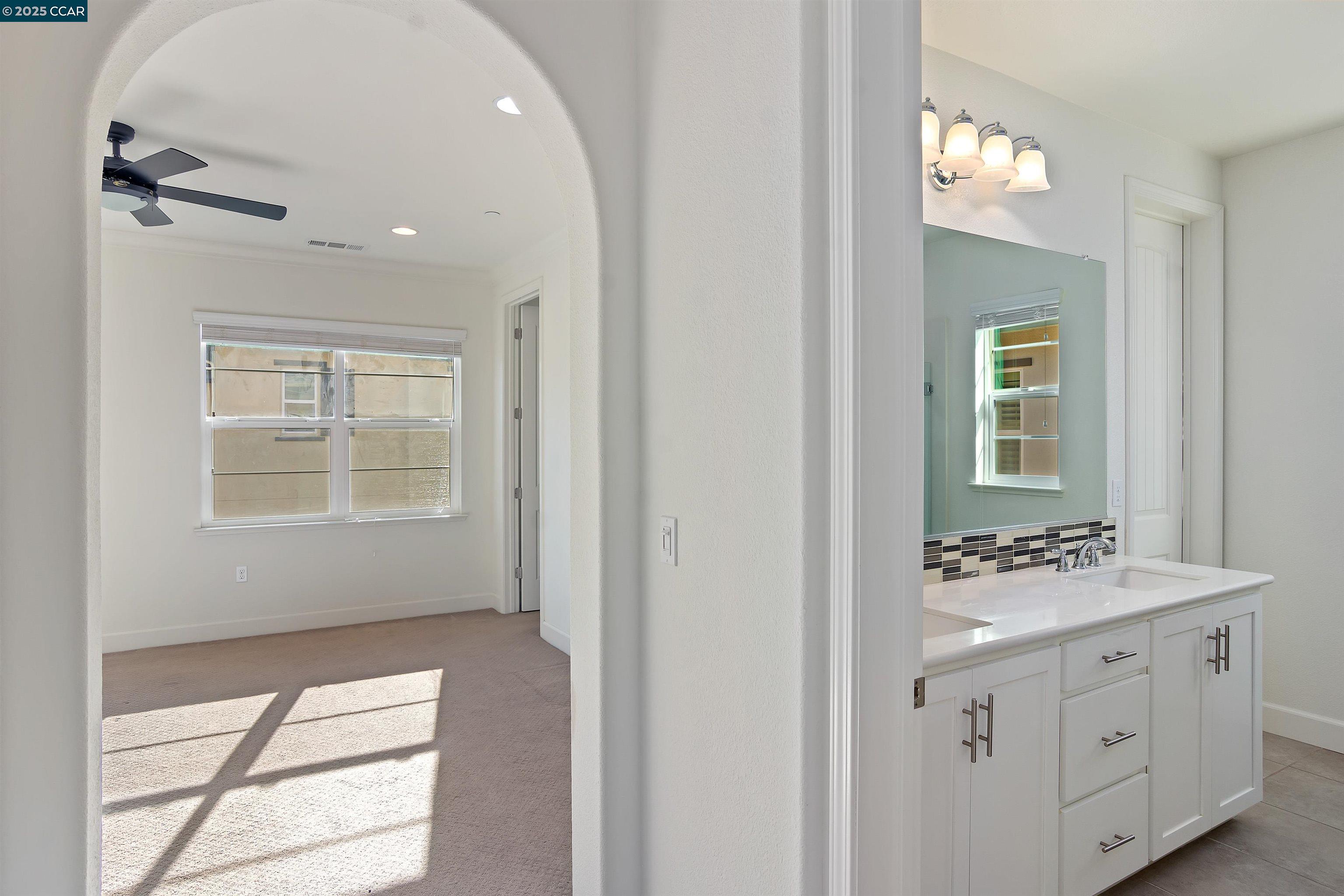 4969 Ivy Leaf Springs Road San Ramon, CA 94582 - Photo 20 of 34 a bathroom with a sink vanity and a mirror