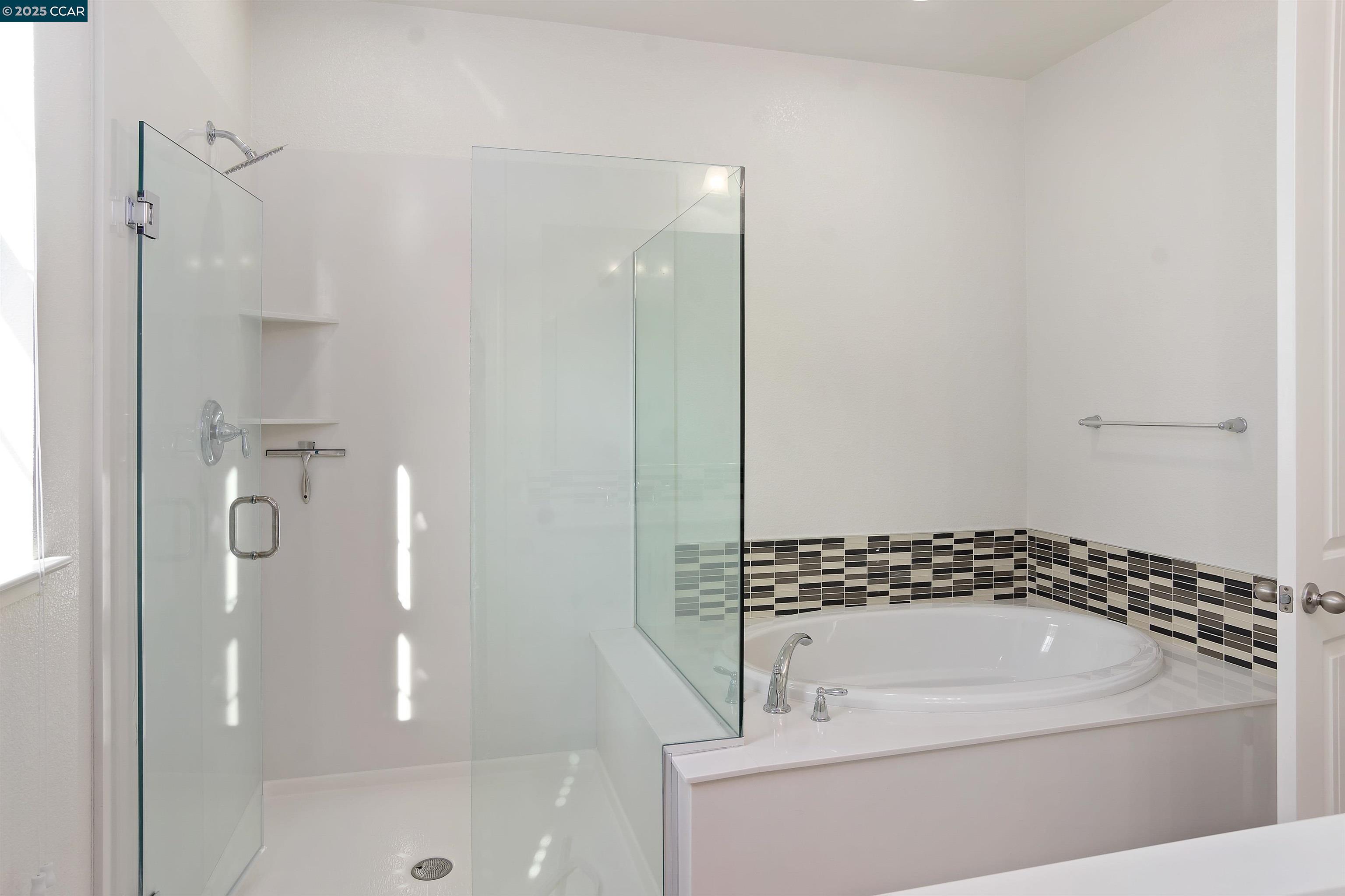 4969 Ivy Leaf Springs Road San Ramon, CA 94582 - Photo 22 of 34 a bathroom with a bathtub and a shower