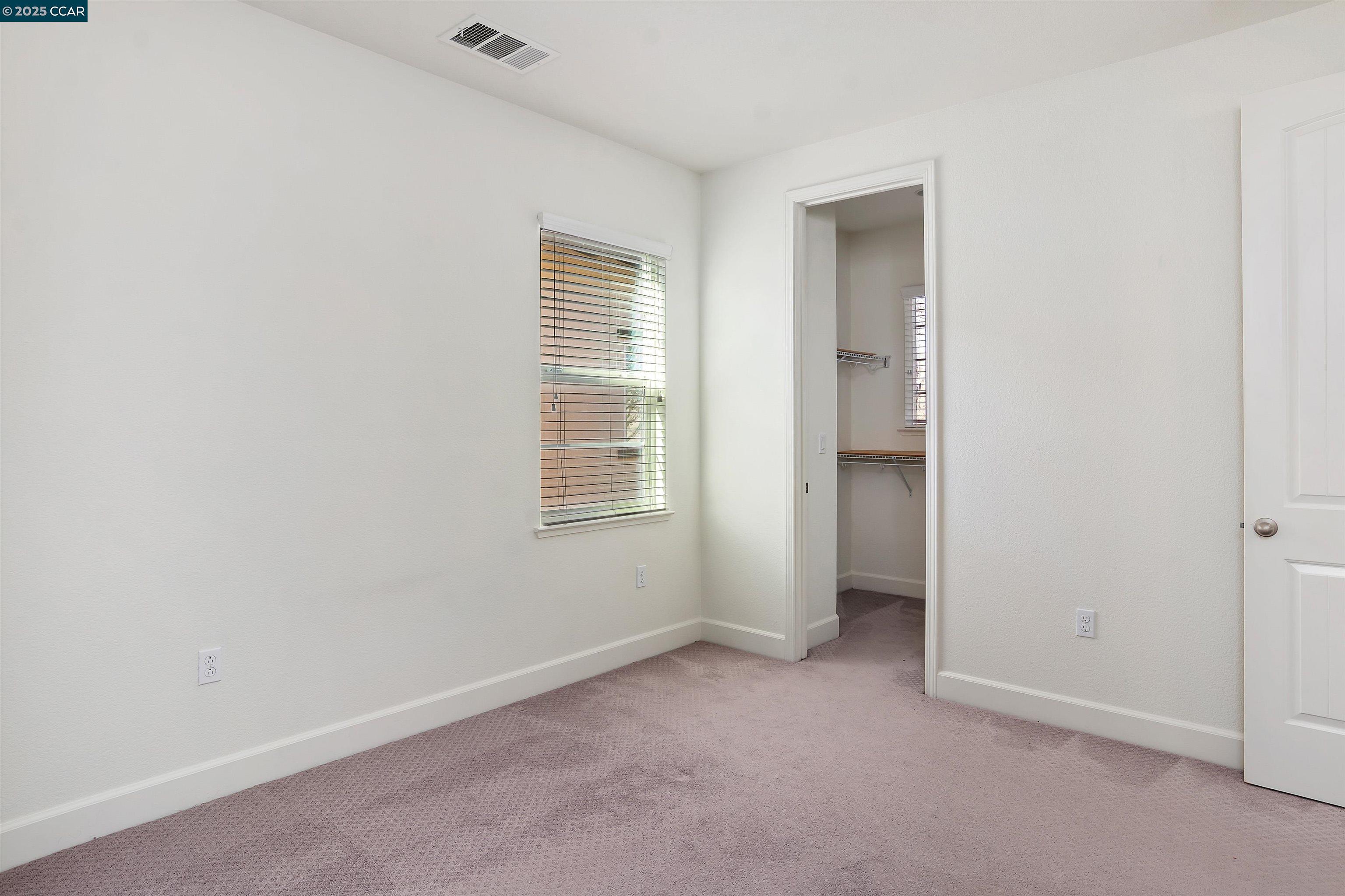 4969 Ivy Leaf Springs Road San Ramon, CA 94582 - Photo 28 of 34 an empty room with windows and closet