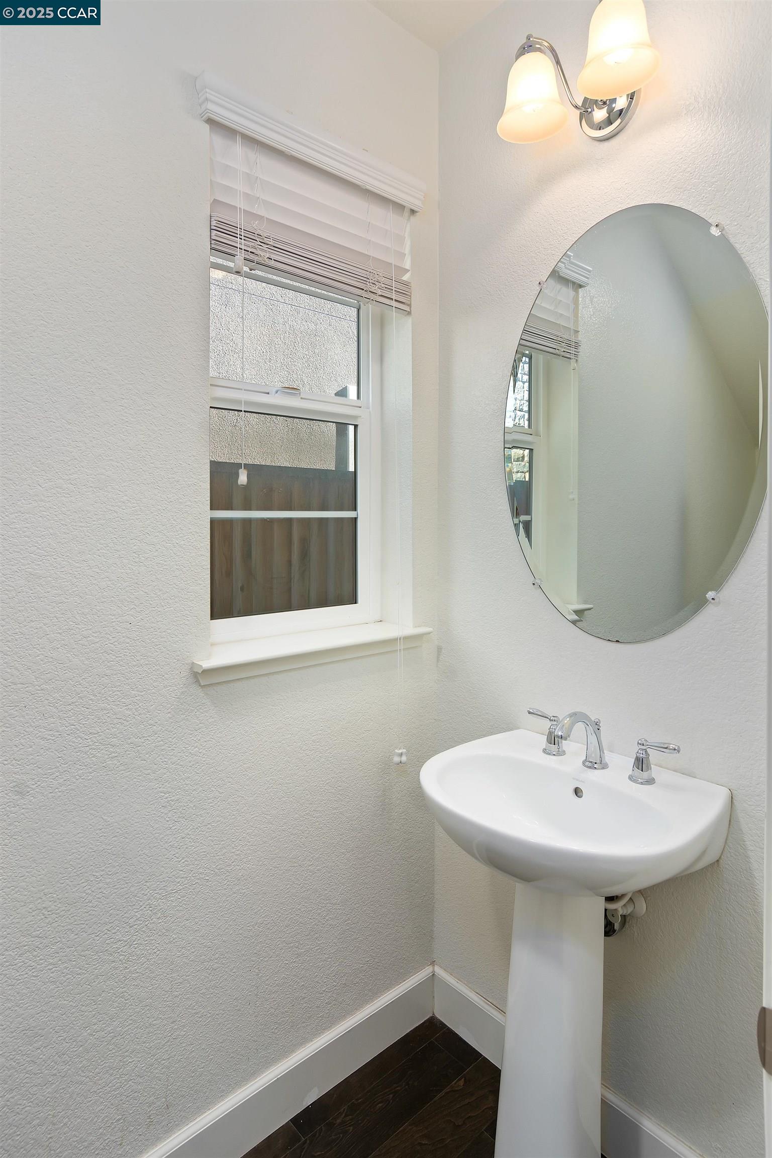 4969 Ivy Leaf Springs Road San Ramon, CA 94582 - Photo 32 of 34 a bathroom with a sink and a mirror