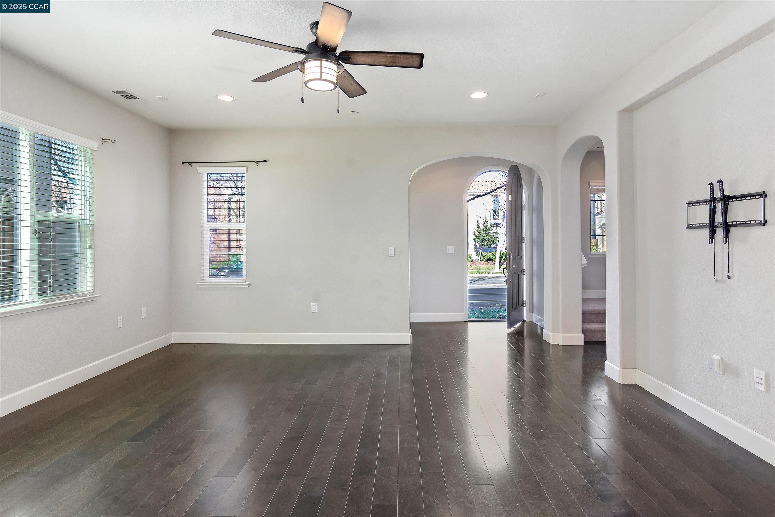 4969 Ivy Leaf Springs Road San Ramon, CA 94582 - Photo 6 of 34 a view of an empty room with a window and wooden floor
