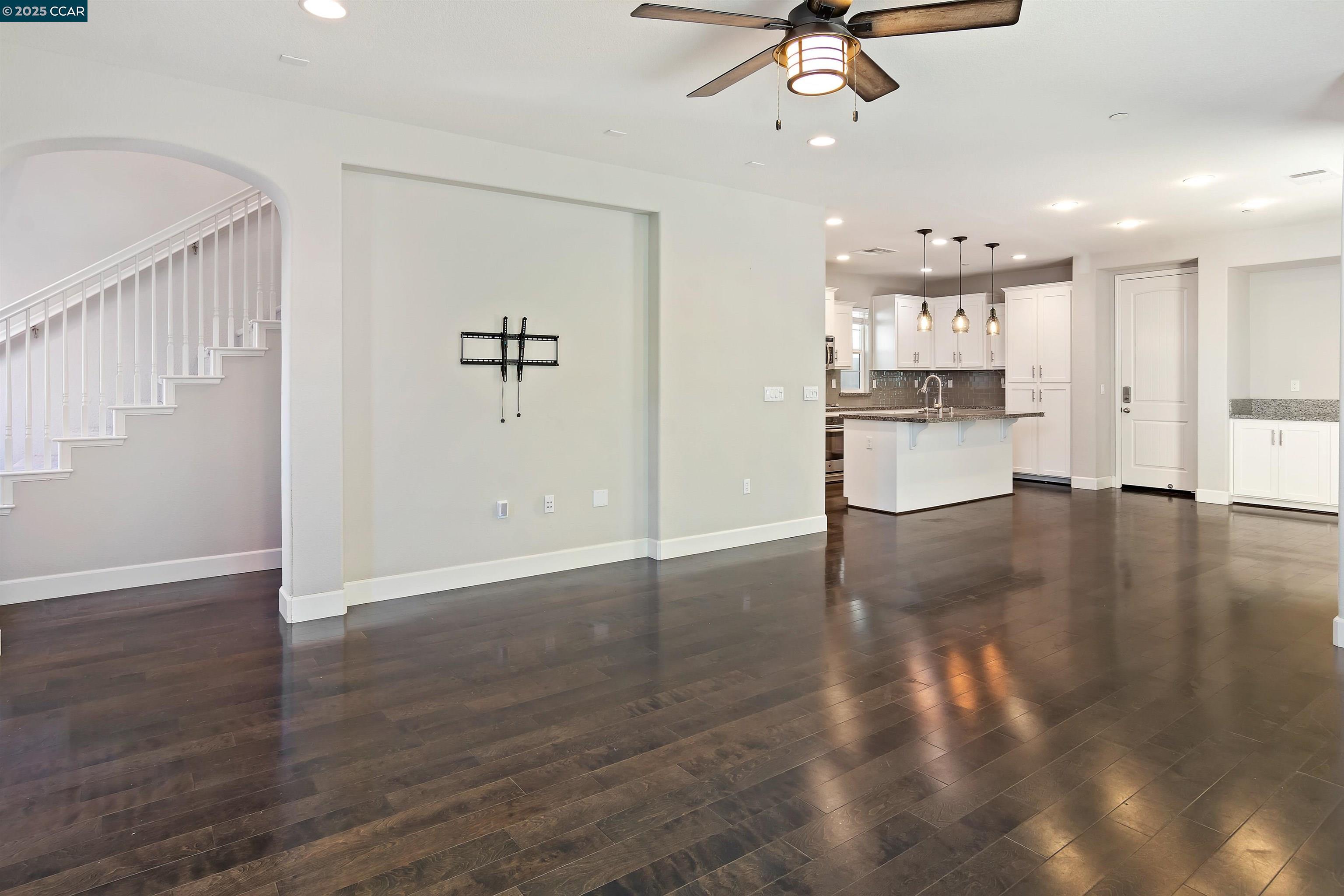 4969 Ivy Leaf Springs Road San Ramon, CA 94582 - Photo 8 of 34 a view of a kitchen with a sink hardwood floor and a ceiling fan