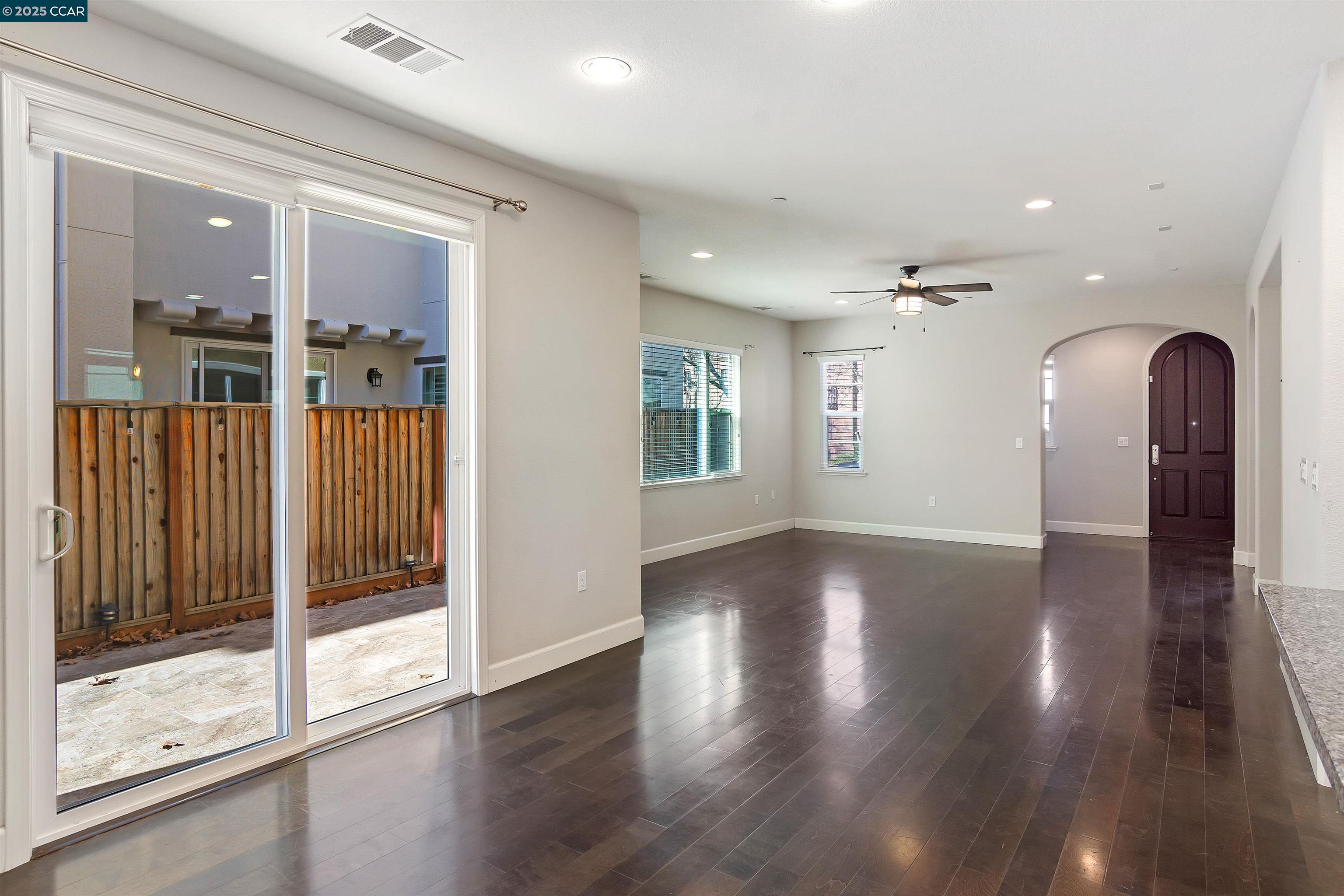 4969 Ivy Leaf Springs Road San Ramon, CA 94582 - Photo 9 of 34 a view of a hallway with wooden floor and glass door