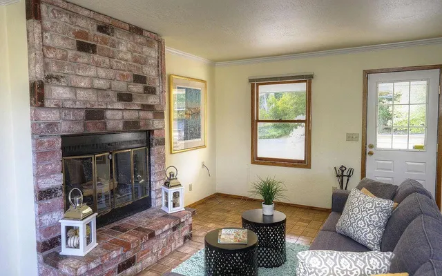 a living room with furniture and a fireplace