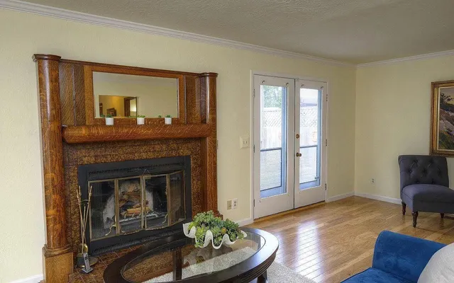 a living room with furniture and a fireplace