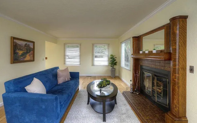a living room with furniture and a fireplace
