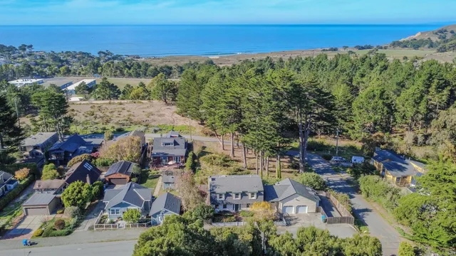 an aerial view of residential building with green space