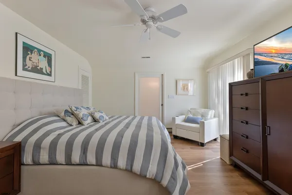 a bedroom with a bed and dresser