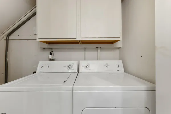 a view of a pathway of a house with backyard and garden