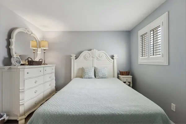 a bedroom with a bed and a closet