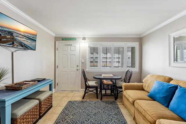 a view of a dining room with furniture and window