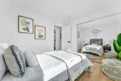 a bedroom with bed and a couch