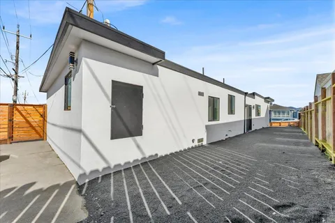 a view of a house with a barbeque