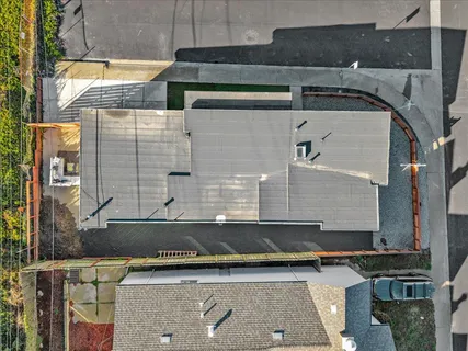 a close view of a sink a stove and storage