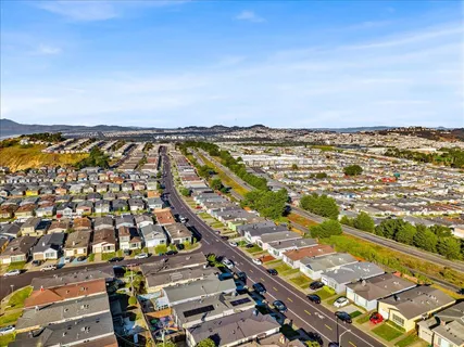 an aerial view of residential building and ocean