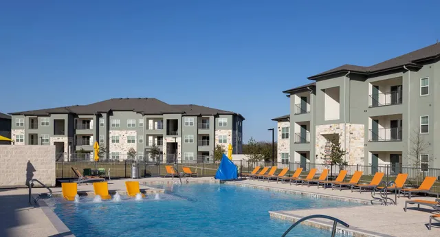 a front view of a house with outdoor seating