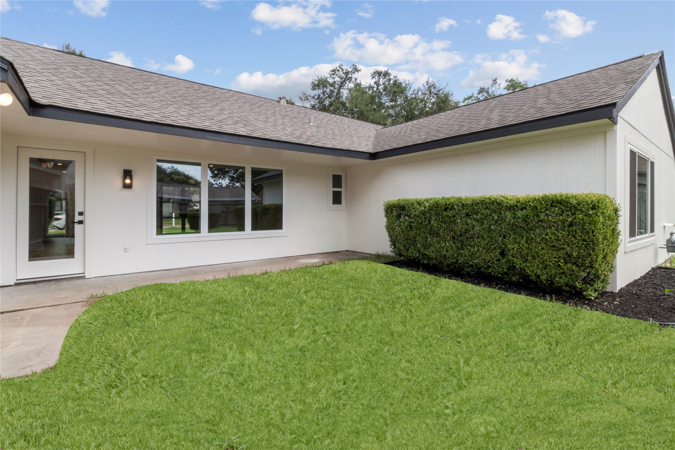 2823 Stetson Lane Houston, TX 77043 - Photo 17 of 19 a house view with a garden space